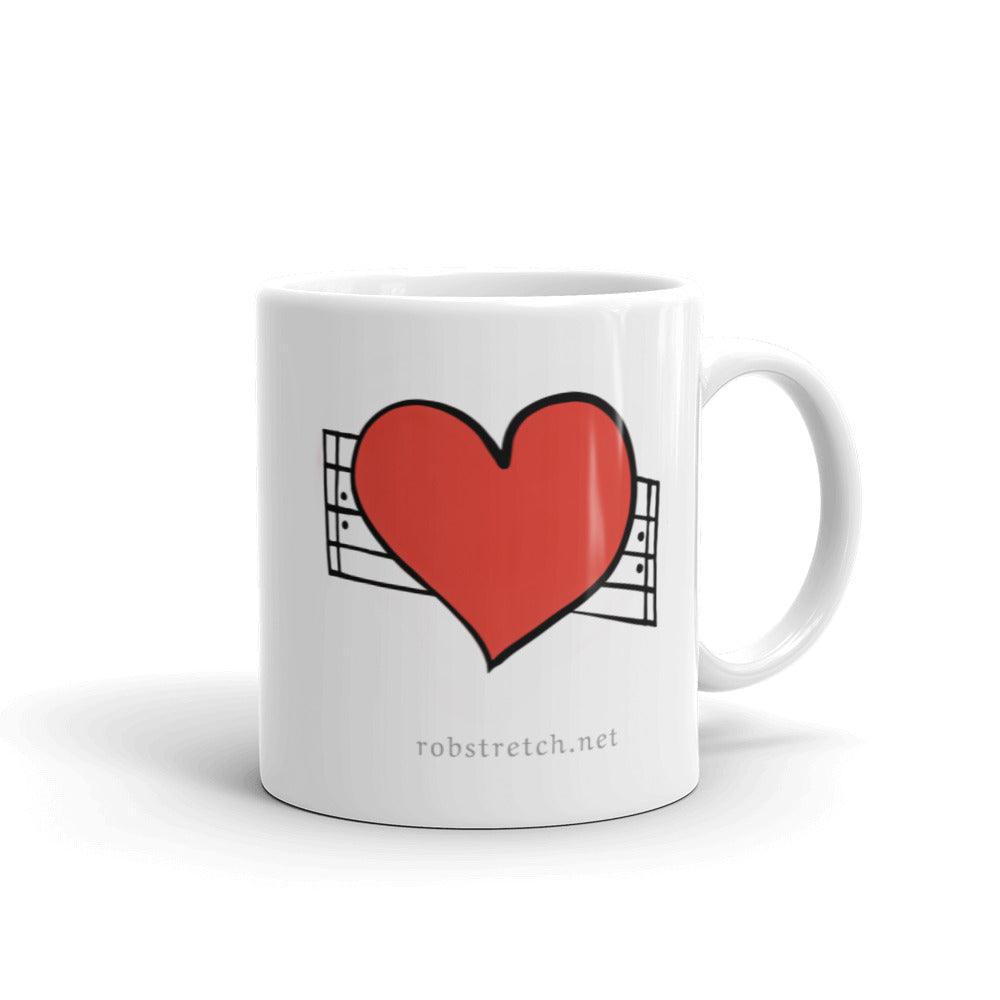 Love Repeat mug featuring a bold red heart design for coffee lovers and art enthusiasts